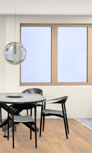 Essbereich mit rundem schwarzen Tisch, vier schwarzen Stühlen, moderner Hängeleuchte und grauem Sofa neben drei großen Fenstern